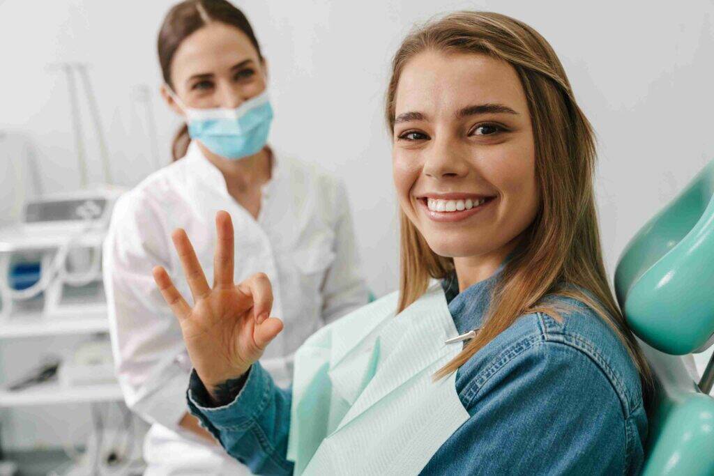 Smiling patient showing approval after a dental treatment.